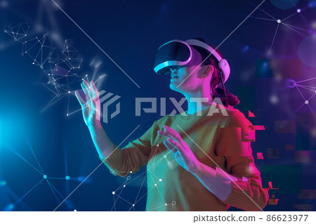Woman with VR virtual reality goggles 86623977