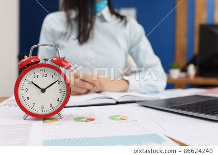 Woman at work, clock set on ten oclock in morning, work in progress Woman at work, clock set on ten oclock in morning, work in progress 86624240