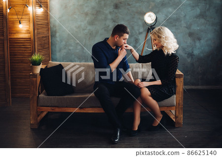 Portrait of boyfriend kissing hand of girlfriend. Portrait of boyfriend kissing hand of girlfriend. 86625140