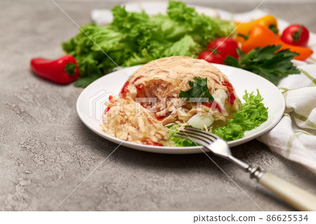 Delicious chicken aspic on a plate on concrete table Delicious chicken aspic on a plate on concrete table 86625534