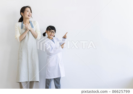 Girl in a lab coat and a housewife 86625799
