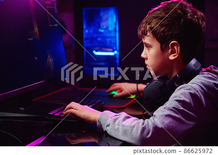 Boy plays computer game at home, gaming addiction 86625972