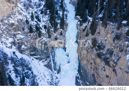 Tears of Leopard Frozen Waterfall in Winter, Aerial View. Landscape of Barskoon Valley, Kyrgyzstan 86626012