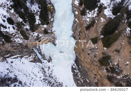 Tears of Leopard Frozen Waterfall in Winter, Aerial View. Landscape of Barskoon Valley, Kyrgyzstan. 86626027