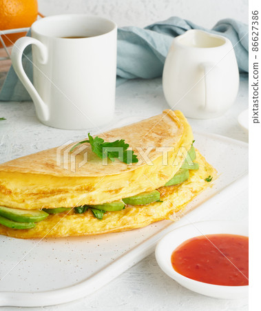 Trendy breakfast with quesadilla and eggs, trending food with omelet, cheese Trendy breakfast with quesadilla and eggs, trending food with omelet, cheese 86627386