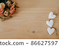 wooden table with an flowers and a heart 86627597