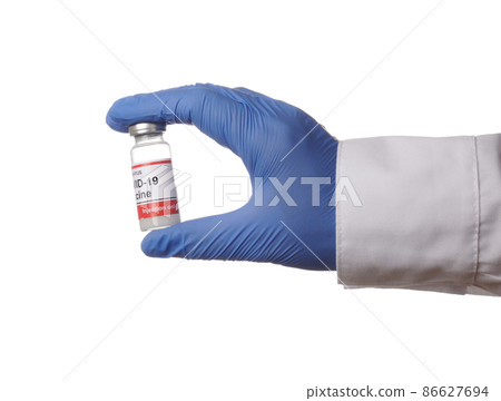 Gloved Hand Presents Covid Vaccine Tube - Isolated Photo Gloved Hand Presents Covid Vaccine Tube - Isolated Photo 86627694