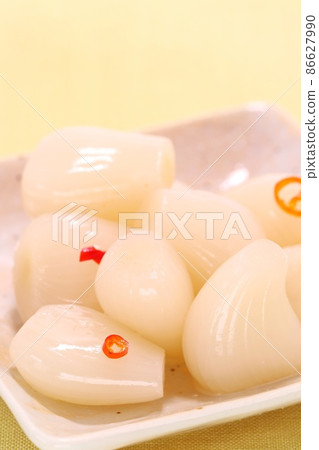 Scallions pickled in sweet and sour sauce, spicy small plate Scallions pickled in sweet and sour sauce, spicy small plate 86627990