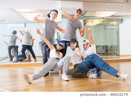 Teens hip hop dancers posing in studio 86628274