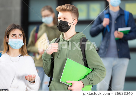 Two teenage students in protective masks 86628340