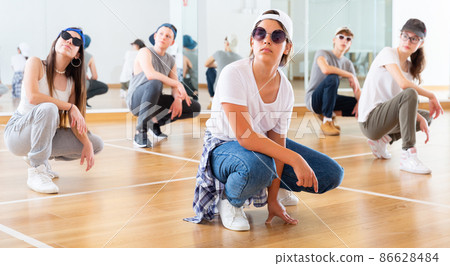 Boy and girls having dancing class Boy and girls having dancing class 86628484