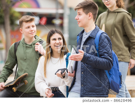 Teenage students talking outside after lessons Teenage students talking outside after lessons 86628496