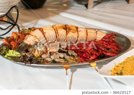 Baked salmon with mackerel and crayfish Baked salmon with mackerel and crayfish 86628527