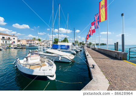 Small port of Lake Garda with Moored Boats - Bardolino Veneto Italy 86628964