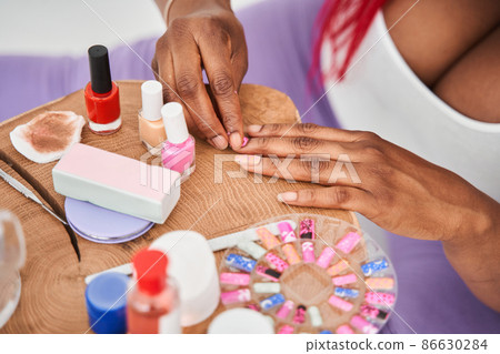 Close up of lady arm demonstrating the process of manicure 86630284
