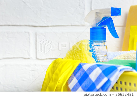 Household goods, equipment for cleaning and housework on the background with copy space. Supplies of sponges for washing, floor cloths, napkins, rubber gloves, bottles for spraying household chemicals Household goods, equipment for cleaning and housework on the background with copy space. Supplies of sponges for washing, floor cloths, napkins, rubber gloves, bottles for spraying household chemicals 86632481