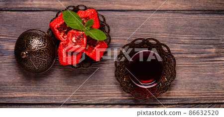 Traditional Turkish Delight with glass of tea 86632520