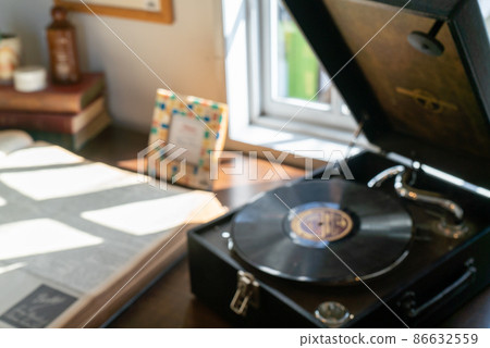 Blurred image: Table with retro record player Blurred image: Table with retro record player 86632559