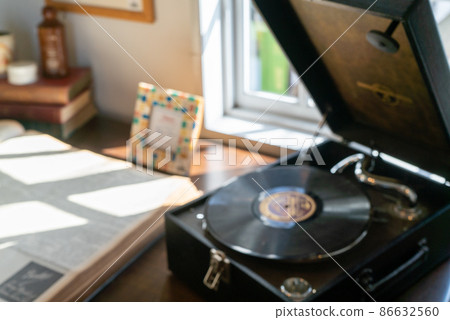 Blurred image: Table with retro record player Blurred image: Table with retro record player 86632560