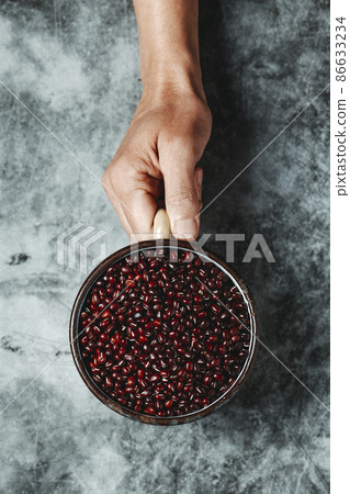 man with a pot full of adzuki beans man with a pot full of adzuki beans 86633234