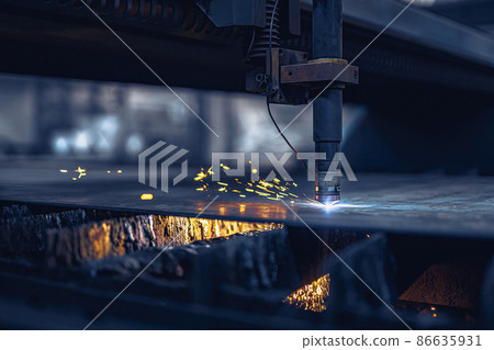 Close up Fiber laser cutting CNC machine cuts metal list. Making metal part. Workshop in factory 86635931