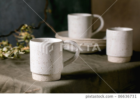 Set of empty craft ceramic coffee cups Set of empty craft ceramic coffee cups 86636731