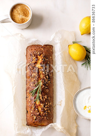 Homemade lemon cake with nuts and rosemary Homemade lemon cake with nuts and rosemary 86636733