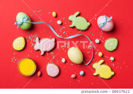 holiday preparation Multi colors Easter eggs with cookies on colored background . Pastel color Easter eggs. holiday concept with copy space holiday preparation Multi colors Easter eggs with cookies on colored background . Pastel color Easter eggs. holiday concept with copy space 86637622