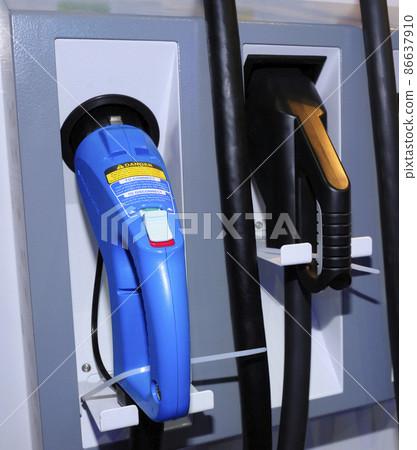 Electric car charger charging an electrical vehicle 86637910