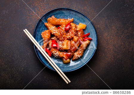 Chinese traditional wok dish sweat and sour deep fried chicken with vegetables stir-fry on plate Chinese traditional wok dish sweat and sour deep fried chicken with vegetables stir-fry on plate 86638286
