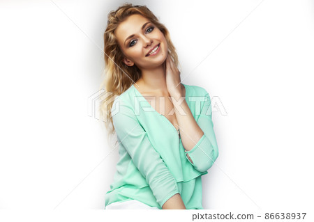 young pretty stylish blond girl posing emotional isolated on white background happy smiling cool smile, lifestyle people concept 86638937