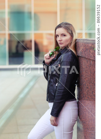 blond girl with long hair in black leather jacket closeup street portrait blond girl with long hair in black leather jacket closeup street portrait 86639152