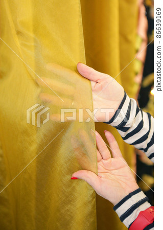 woman hand choosing curtain and accessories samples for window design clos up photo woman hand choosing curtain and accessories samples for window design clos up photo 86639169