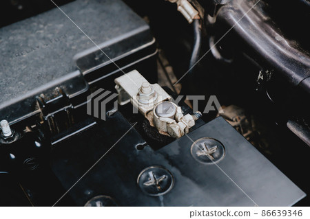 Battery cathode terminal is installed on a black battery of the car electric system Battery cathode terminal is installed on a black battery of the car electric system 86639346