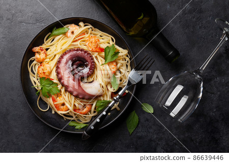 Seafood pasta with octopus and shrimps 86639446
