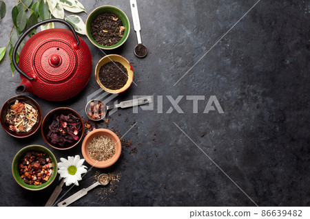 Various dried tea and teapot 86639482