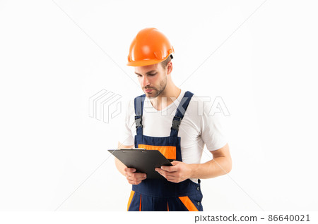 guy in protective helmet making notes. man in helmet hold project. 86640021