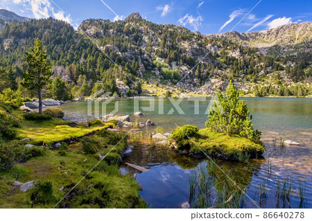 Summer landscape in La Cerdanya, Pyrenees mountain lake, Catalonia, Spain. Summer landscape in La Cerdanya, Pyrenees mountain lake, Catalonia, Spain. 86640278