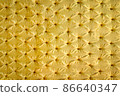 Large full frame background of classic and luxury furniture or interior design - golden velvet sofa upholstery in the royal style 86640347