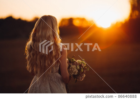 Unrecognazible blondy bride looking away and Unrecognazible blondy bride looking away and 86640888