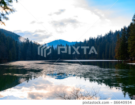 Panorama of Lake Synevyr, a picturesque mountain lake, a lake in the mountains. Panorama of Lake Synevyr, a picturesque mountain lake, a lake in the mountains. 86640934