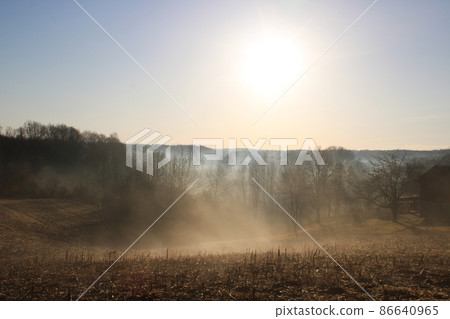 Winter morning, fog, sun and the sky over the frozen countryside near Zagreb, Croatia 86640965