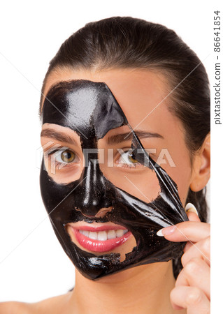 Beauty portrait of brunette woman with black mask. 86641854