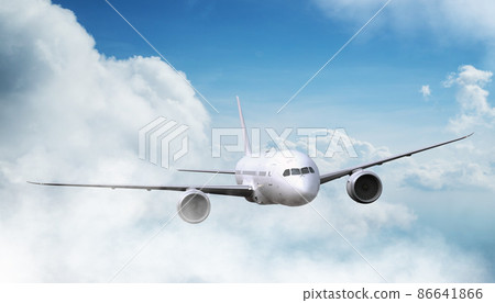 Passengers commercial airplane flying above clouds in sunset light. 86641866
