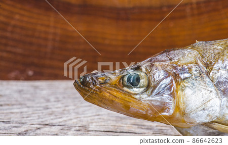 Fresh raw silver fish smelt fried in a skillet Fresh raw silver fish smelt fried in a skillet 86642623