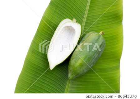 Green papaya on banana leaf Green papaya on banana leaf 86643370