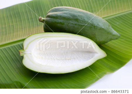 Green papaya on banana leaf Green papaya on banana leaf 86643371