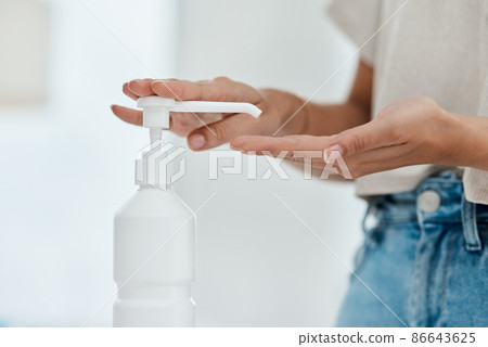 Hand sanitizer kills many harmful germs. Cropped shot of an unrecognizable woman sanitising her hands. Hand sanitizer kills many harmful germs. Cropped shot of an unrecognizable woman sanitising her hands. 86643625