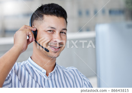 Yes we should be able to handle this no problem. Shot of a young businessman working in a call center office helping a client. 86643815