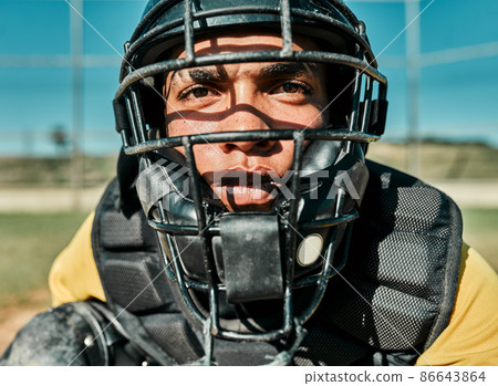 Hes the quickest thinker on the team. Shot of a young player wearing a catchers helmet while playing baseball. Hes the quickest thinker on the team. Shot of a young player wearing a catchers helmet while playing baseball. 86643864